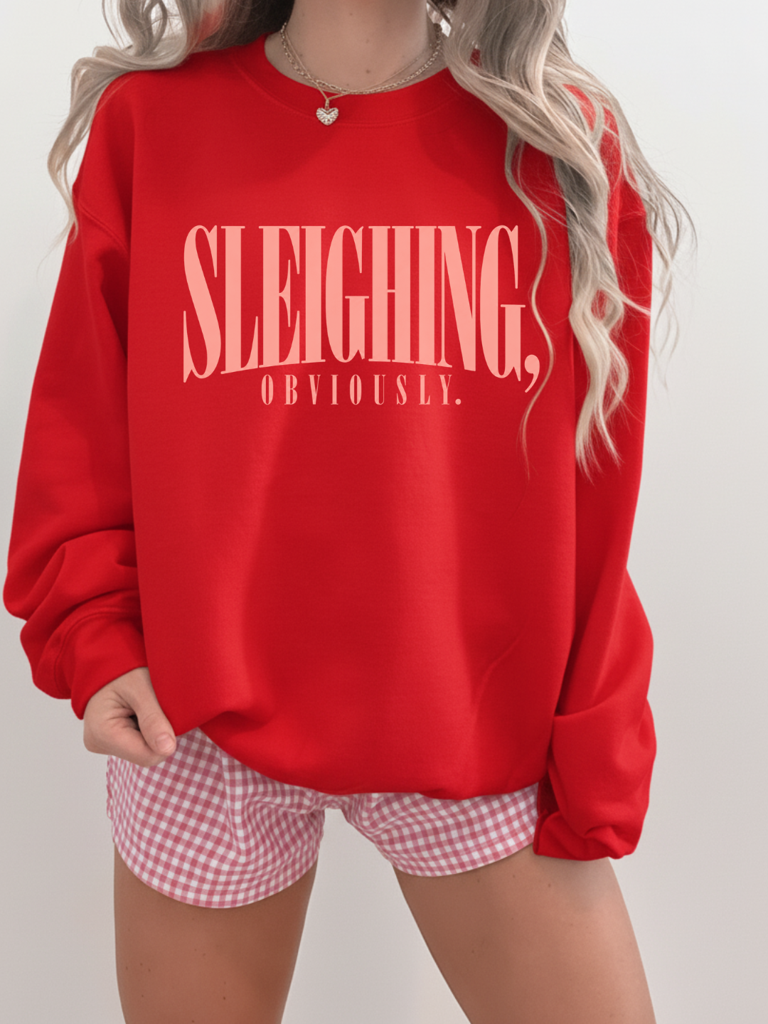 a woman wearing a red sweater