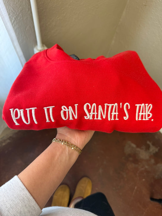 a person holding a red sweater