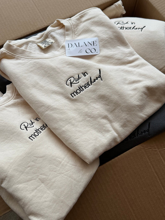 a group of white shirts with black text on them